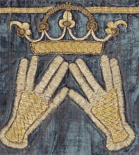 ark curtain of blue velvet with golden stiched designs of a top border, crown and hands in the blessing position of the kohanim, like a two-handed Mr. Spock gesture