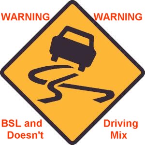 Traffic sign shows icon for slippery road and reads, 'WARNING: BSL and Driving Doesn't Mix'.